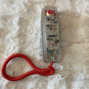 Transparent clear 90s telephone with red cord